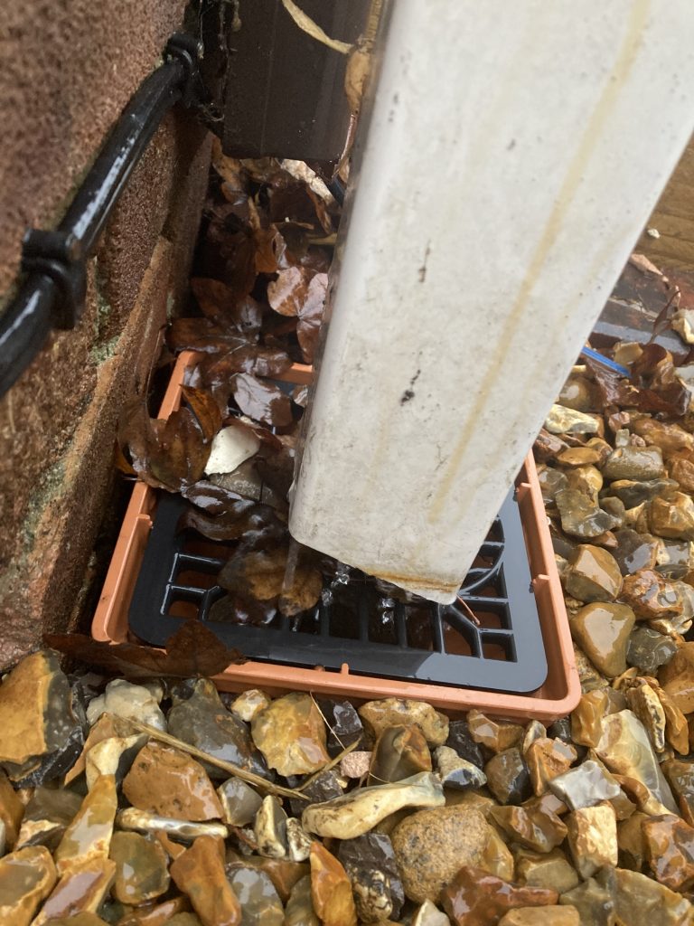Wiltshire home with grid hopper installed to protect the soakaway from gutter debris as an alternative to gutter brushes.